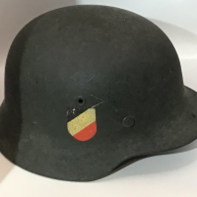 WW2 German Army (Heer) M35 Double Decal Steel Combat Helmet, fine example retaining much of the original apple green paint finish to the shell. Complete with original German army (heer) eagle decal and national tri-colour With leather liner and interior stamp mark FT64 and 440.