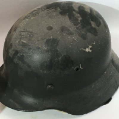 A German Third Reich Army helmet M35 pattern with a leather liner and stamped number 20212.