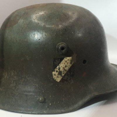 An interesting and possible rare transitional German Steel helmet M17 pattern with two decal to the side possible original. No liner.