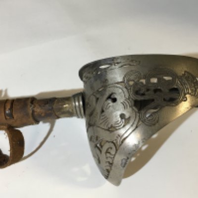 A George V officers sword 1897 pattern etched blade with a leather field service scabbard.