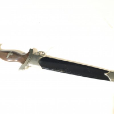 A German Third Reich II world war SA dagger with walnut grip makers stamp to the blade and conforming engraved numbering to the hilt and scabbard.