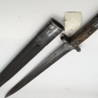 A 1907 British Bayonet made by Wilkinson the blade with other marks leather scabbard slightly split. Length 46cm