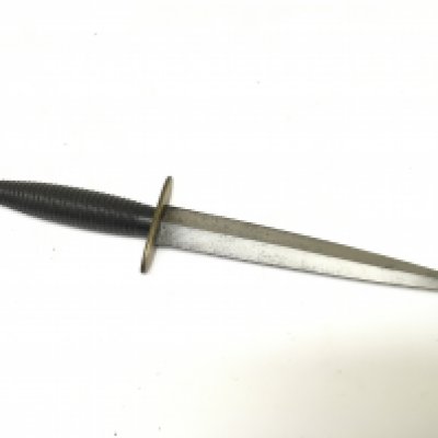 A Fairbrain Sykes commando British fighting knife with oval ended Brass cross guard blacked metal ribbed grip. Length 29cm