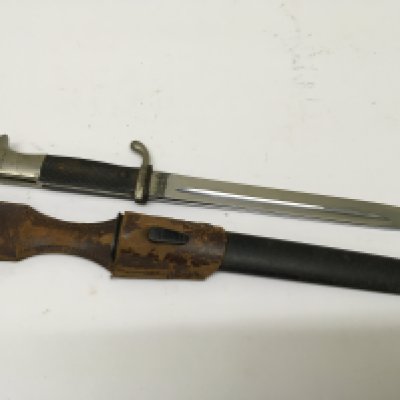 A German Third Reich K98 dress bayonet with leather frog attached maker Verchromt. Length 40cm