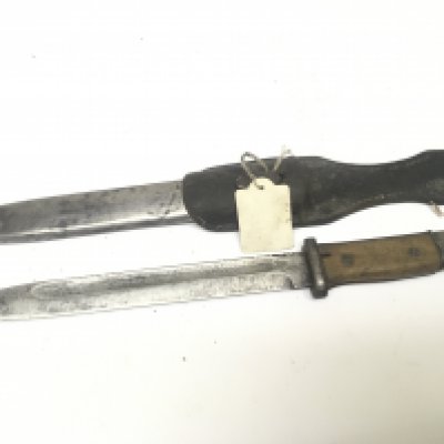 An Early German II world war K98 bayonet with wood grip and steel scabbard with leather frog the blade with stamp marks Cof 43 and serial number 82650.
