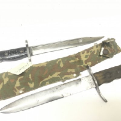 A Military fighting knife with camouflage scabbard and a bayonet possible for SLR stamped Lia3 9600257. (2)