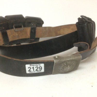 A German Third Reich II world war Military belt buckle with attached leather belt and magazine pouches possible of a later date.