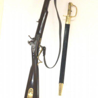 A replica Tower Flint lock Rifle Musket with brass fittings and steel barrel the flintlock action with Tower Proof marks sold with a bayonet. PLEASE NOTE A FIREARMS LICENSE IS REQUIRED TO BUY THIS LOT VIEWING AND COLLECTION BY APPOINTMENT ONLY.