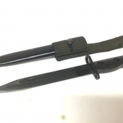 A British SLR bayonet believed to be a Falklands war relic stamped LIA3 9600257 D67 with scabbard and woven frog.