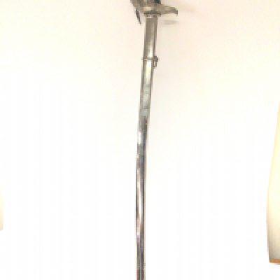 A Toledo 1895 pattern sword with a shaped grip full cross guard with etched emblem. Length 98cm