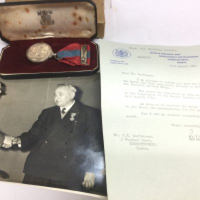 An imperial service medal and related paperwork awarded Joseph Charles Scrivener. Shipping category B.