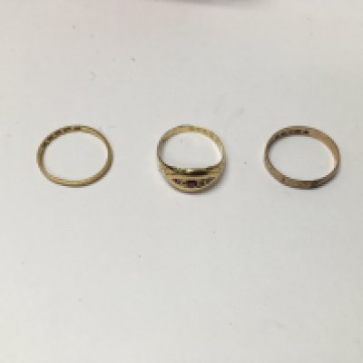 Three gold rings , including one 9ct gold ring, one 18ct told ring and another 22ct gold band.