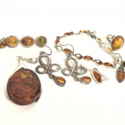 A Collection of silver and amber jewellery including earrings, bracelet etc. postage category A
