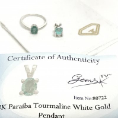 18 carat white gold Paraiba Tourmaline pendant and a silver ring. With Certificate. Postage category A