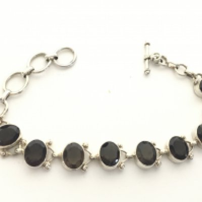 A silver oval smokey quartz bracelet, postage category A