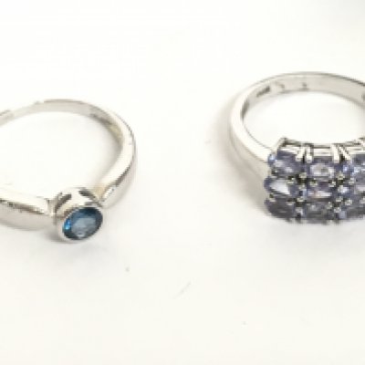 A 9 carat white gold ring set with a topaz stone 2.3g (N) and a silver tanzanite cluster ring (size N). Postage category A