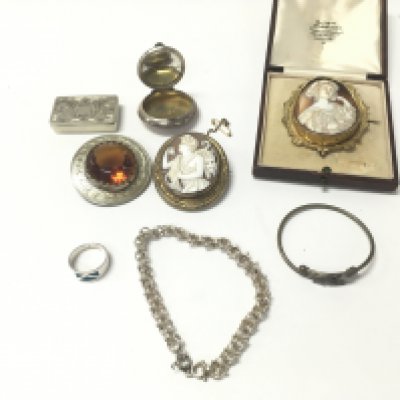A collection of costume jewellery including vintage cameos and silver items. Postage B