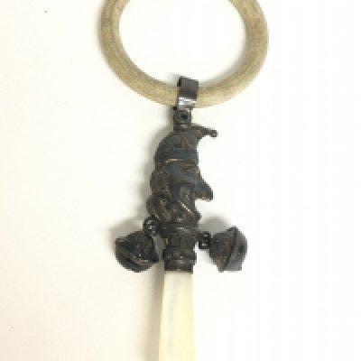 A Silver hallmarked baby rattle with Punch design & a mother of pearl handle. Postage category A
