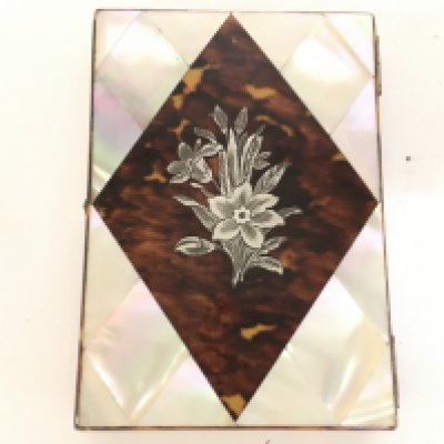 A Mother of Pearl cigarette case with inlaid silver floral design. Approx 8x10cm Postage category A