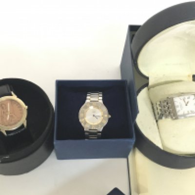 Dress watches including a Cartier Must de watch, Raymond Weil Geneve, Penny watch. Postage category B