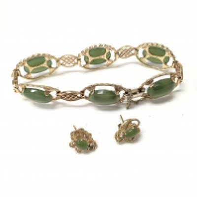 A 9ct gold jade set bracelet with a gold plated pair of jade earrings. Approx gold weight 14.4 grams.