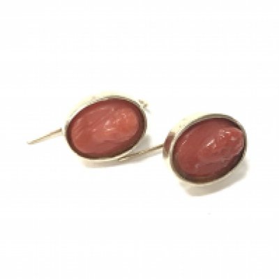 A pair of coral earrings. Postage A