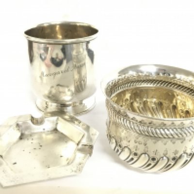 A collection of silver hallmarked items including a christening mug, bowl and ashtray. Postage category B