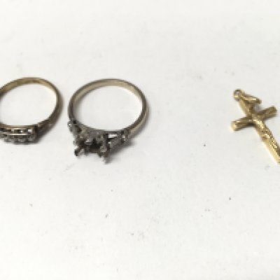 An 18ct gold cross and two 18ct gold rings. Approx weight 6.9 grams.