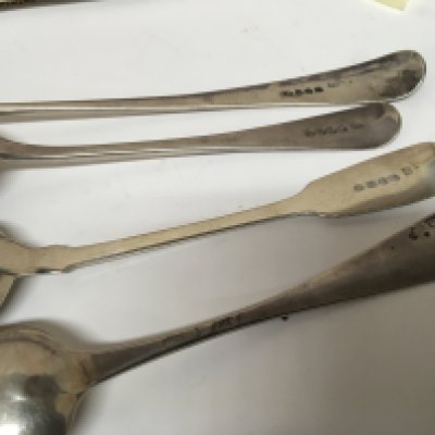 Three George III silver table spoons and possibly a George II spoon marks worn including a basting spoon mixed hallmarks. (4)