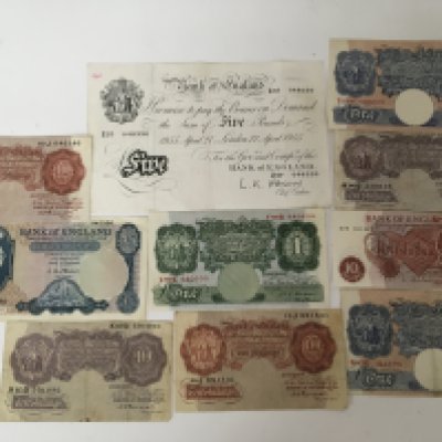 A 1955 White five pound note and other British bank notes five pounds pounds and ten shilling notes .
