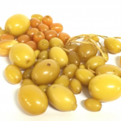 A bag of yellow amber beads. Postage category A