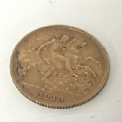 A George V half Sovereign dated 1913.