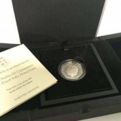 A cased 2023 King Charles III Coronation Silver Proof Fifty Pence coin, limited edition of 995. Postage category a