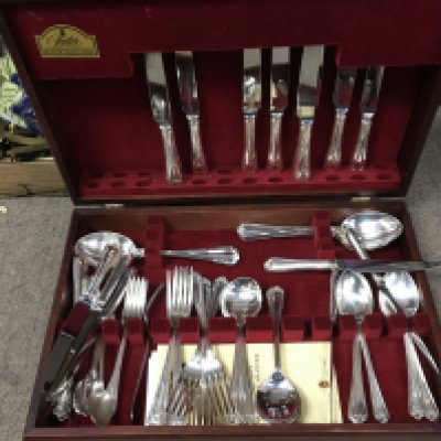 A canteen of cased Butler Cutlery and two silver plated trays. This lot cannot be posted