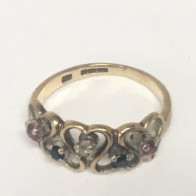 A 9carat gold ring set with a pattern of small ruby sapphire and diamond.