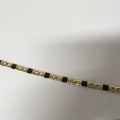A 14 carat gold bracelet decorated with black enamel length 21cm approximately weight 31g