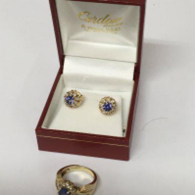 A pair of 14carat gold earrings with a matching ring set with Tanzanite and brilliant cut and baguette diamonds. Ring size I