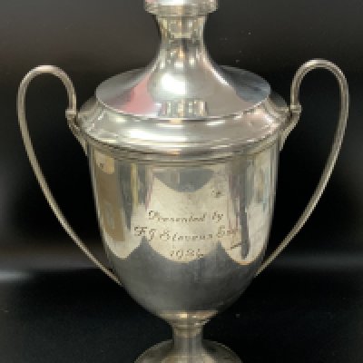 A hallmarked silver trophy cup and cover. 33cm. 827g.