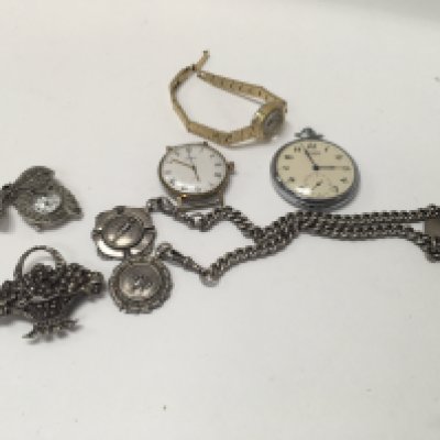 A silver watch chain with watches and a brooch.