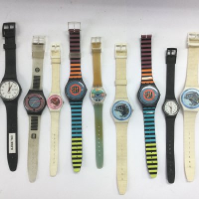 A collection of Swatch watches. Shipping category A.