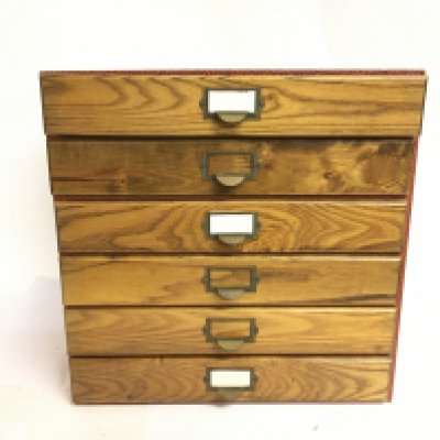 A six draw cabinet containing mixed coinage including 19th Century pennies, one pound notes, shillings. This lot cannot be posted