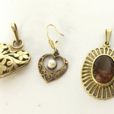 A collection of 9 carat gold pendants, total weight 7.6g. Postage category A