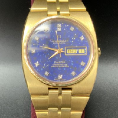An 18ct yellow gold Constellation Automatic Omega Chronometer day date wrist watch with Stardust (Lapis Lazuli) and Diamond set dial, overall weight 151g. 36mm including crown. (B) no Box or paperwork.