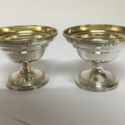 A pair of late 18th Century George III silver and parcel gilt salt cellars of circular shape with conforming base. London 1798 hallmarks by Stephen Adams heigh 6.5cm