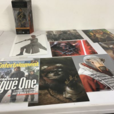 A collection of 9 Star Wars autographs including signed Giden boxed figure..Daisy Ridley..Felicity Jones..Paul Hasley plus others.  Some with COA.