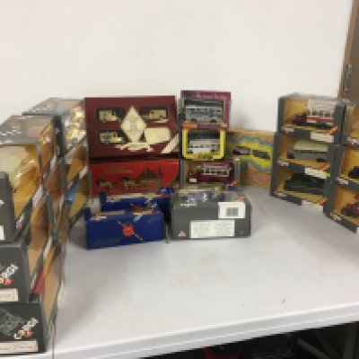 A collection in excess of 25 of boxed diecast model vehicles mainly buses and coaches by Corgi with 3 by Matchbox- Lledo.  No reserve