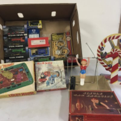 A mixed collection of toys with some vintage tin.   Includes Boxed mechanical clockwork  Lucky Mouse a boxed clockwork Single Bar Exercise. plus boxed locos ..jigsaw..cars hand operated ferris wheel etc.  no reserve. 