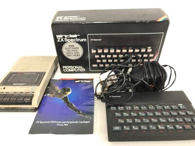 A Boxed Sinclair ZX Spectrum. With Tape Deck And Games.