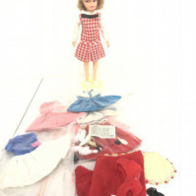 A Ideal Toys Corporation Pepper Doll. With Extra Clothes And Stand.