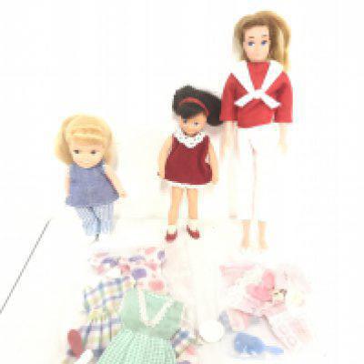 A Pedigree Betsy Doll And 2 Others. With Some clothes.